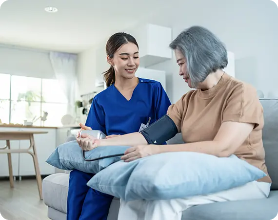 Smiling senior receiving In-Home Care Services for Seniors